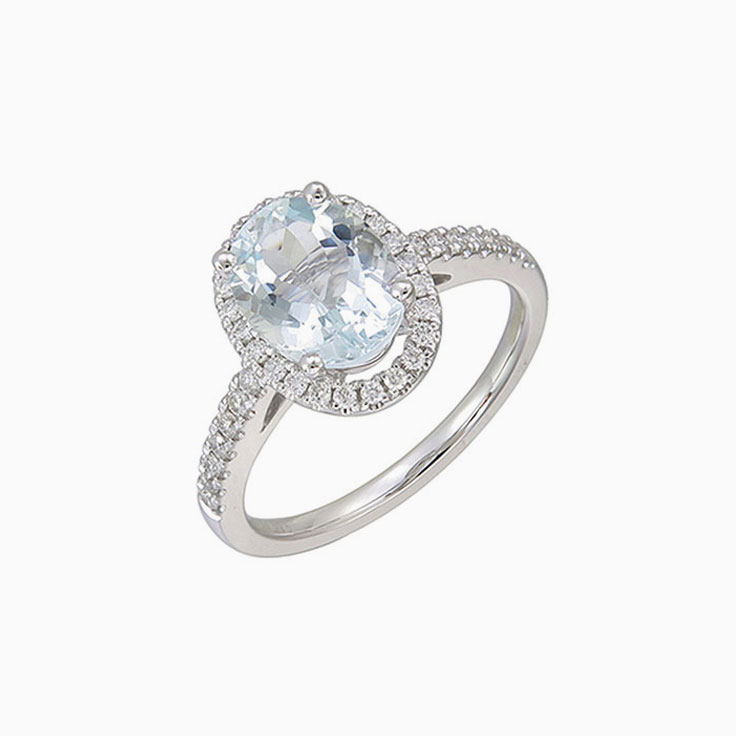 Oval Aquamarine with diamond halo ring