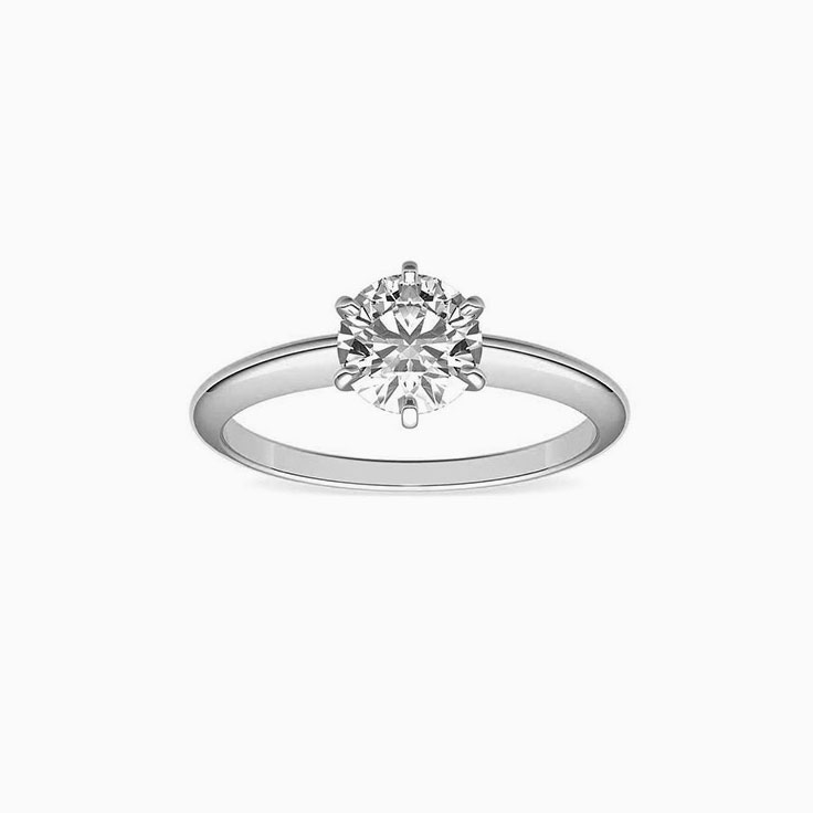 Knife edge engagement ring with round brilliant diamond