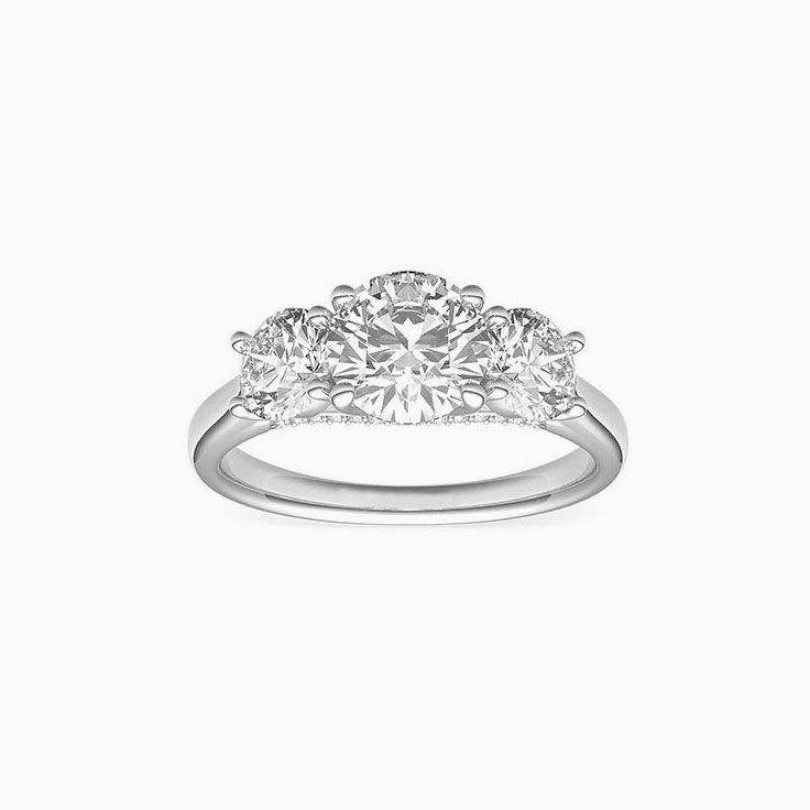 Round brilliant cut diamonds in a trilogy setting engagemnt ring