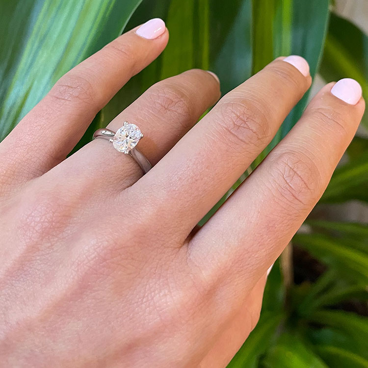 Oval solitaire Engagement ring on a plain band
